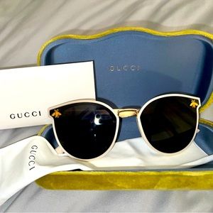 Authentic Gucci sunglasses with case and authentication card.